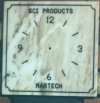 GCI PRODUCTS AND MARTECH CLOCK LIGHT BROWN WITH WHITE MARBLED 4 NUMBER CLOCK SURROUNDED BY BLACK BORDER WITH BLACK NUMBERS.